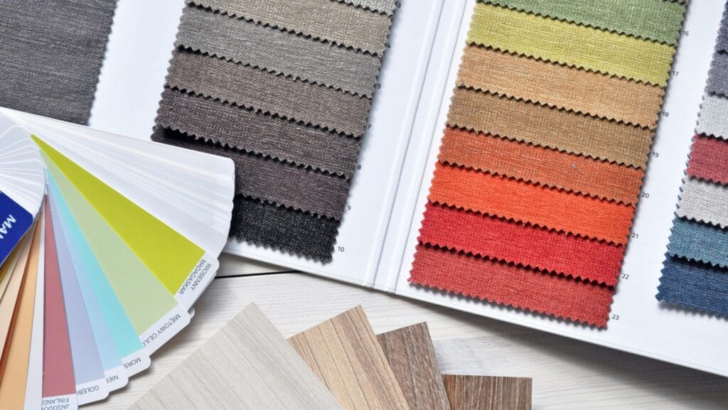 Fabric swatches and color cards representing textile classification and HS code identification in Vietnam
