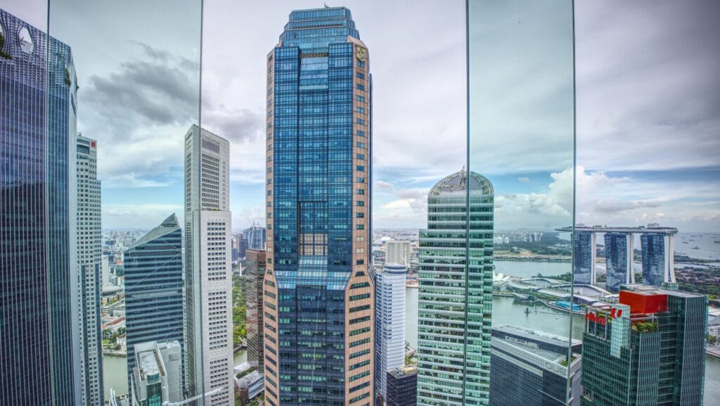Panoramic view of Southeast Asia’s modern skyline with high-rise buildings and Marina Bay Sands in background