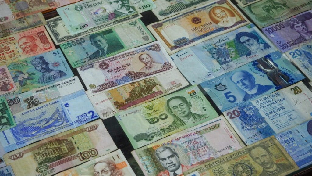 Assorted international banknotes representing global financial flows and foreign direct investment